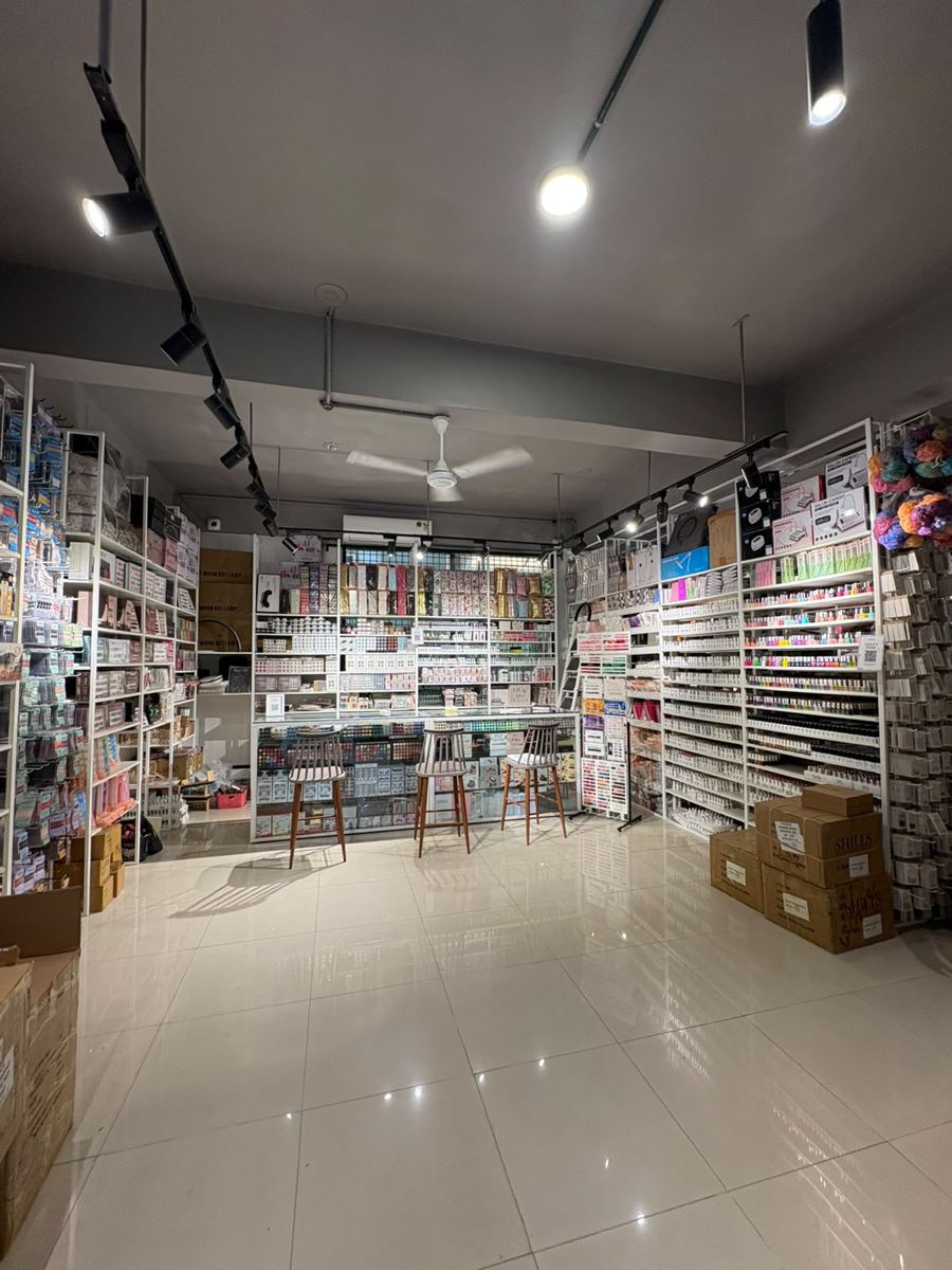 Shelves of nail art and salon products inside the Choice showroom